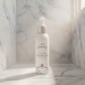 Ageless Lumina Peptide Face Wash in marble shower